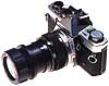 The end product mounts on most 35 mm cameras, takes good close-ups and can double as a slide viewer.